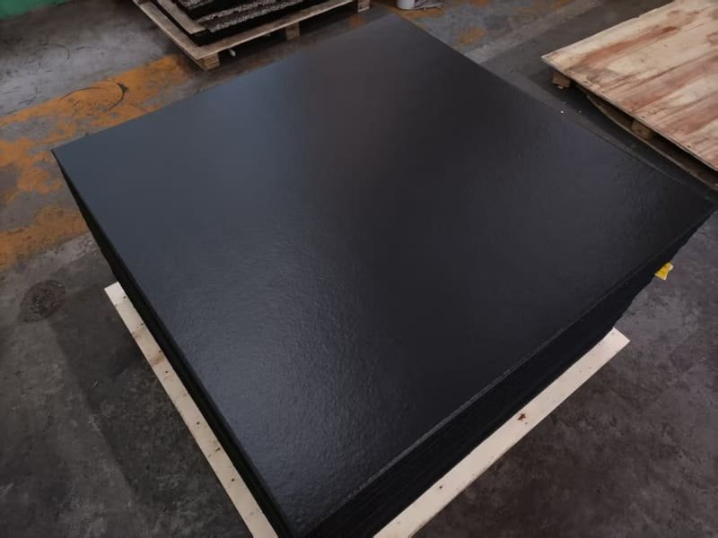 Quality control inspector testing rubber floor